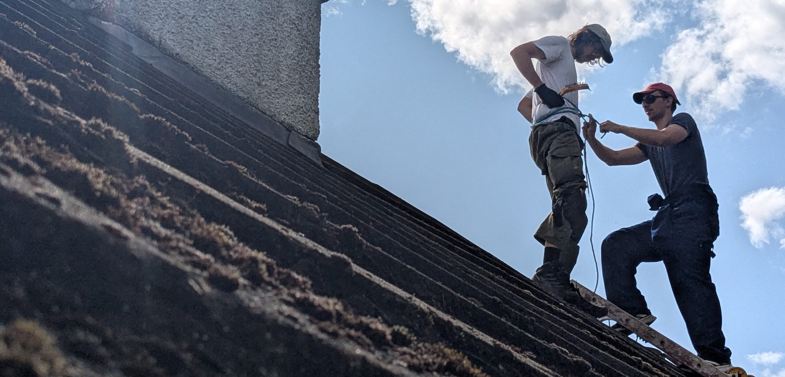 Luca Wolfe Murray fixing a roof in Torridon
