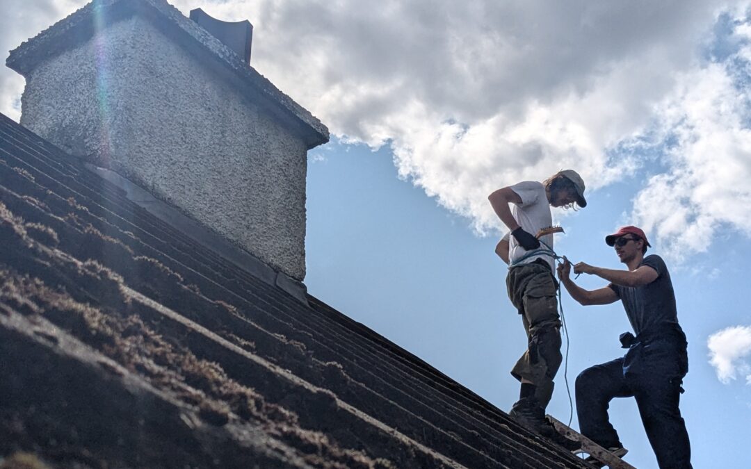 Luca Wolfe Murray fixing a roof in Torridon